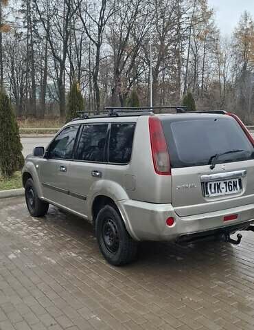 Сірий Ніссан ІксТрейл, об'ємом двигуна 2.2 л та пробігом 327 тис. км за 3071 $, фото 4 на Automoto.ua