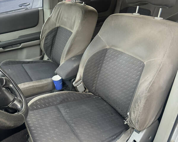 Серый Ниссан ИксТрейл, объемом двигателя 2.5 л и пробегом 250 тыс. км за 3899 $, фото 17 на Automoto.ua