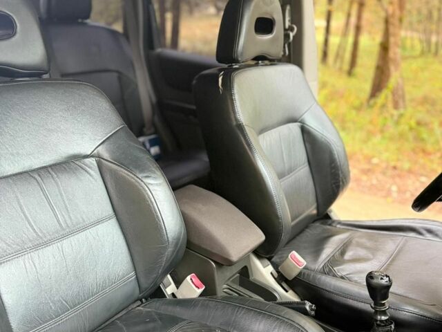 Сірий Ніссан ІксТрейл, об'ємом двигуна 2 л та пробігом 317 тис. км за 4000 $, фото 4 на Automoto.ua