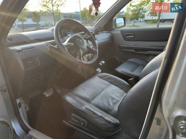 Серый Ниссан ИксТрейл, объемом двигателя 2.5 л и пробегом 360 тыс. км за 6417 $, фото 11 на Automoto.ua