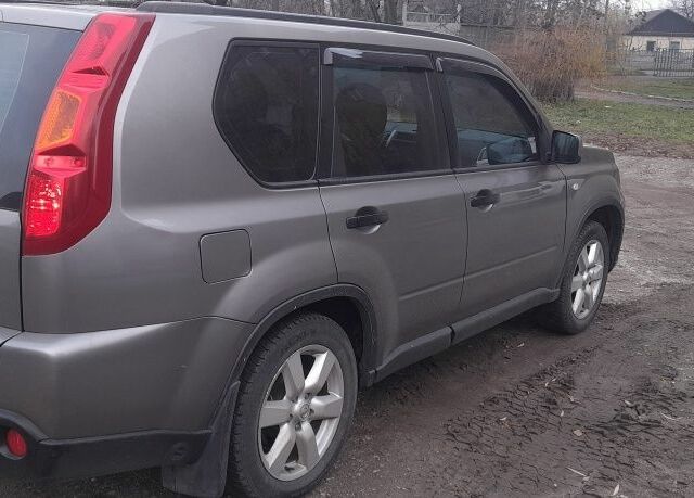 Серый Ниссан ИксТрейл, объемом двигателя 2 л и пробегом 195 тыс. км за 8300 $, фото 10 на Automoto.ua
