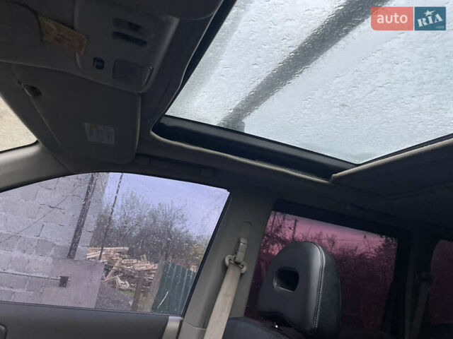 Синий Ниссан ИксТрейл, объемом двигателя 2.4 л и пробегом 299 тыс. км за 4600 $, фото 3 на Automoto.ua