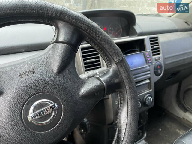 Синий Ниссан ИксТрейл, объемом двигателя 2.4 л и пробегом 299 тыс. км за 4600 $, фото 8 на Automoto.ua