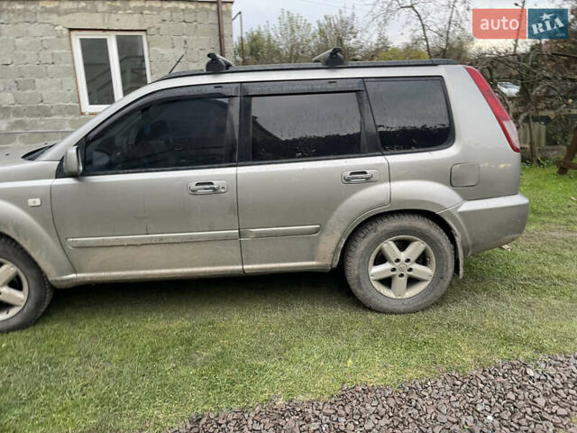 Синий Ниссан ИксТрейл, объемом двигателя 2.4 л и пробегом 299 тыс. км за 4600 $, фото 2 на Automoto.ua