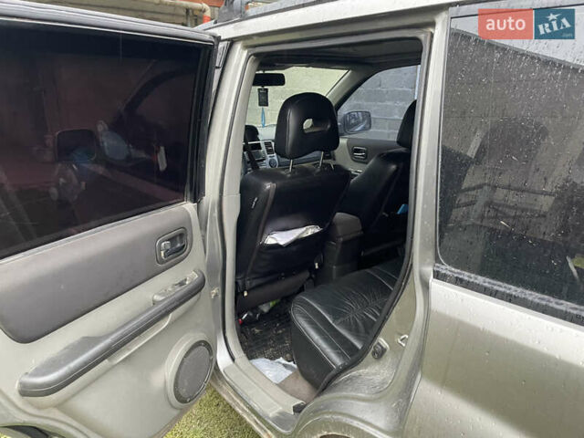 Синий Ниссан ИксТрейл, объемом двигателя 2.4 л и пробегом 299 тыс. км за 4600 $, фото 12 на Automoto.ua