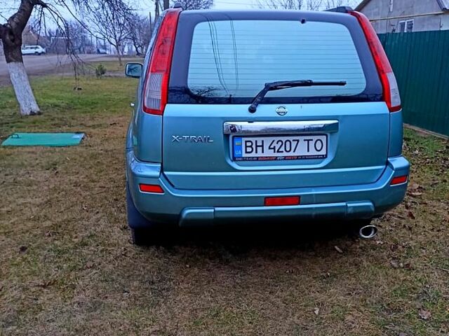 Зеленый Ниссан ИксТрейл, объемом двигателя 2 л и пробегом 160 тыс. км за 5600 $, фото 2 на Automoto.ua