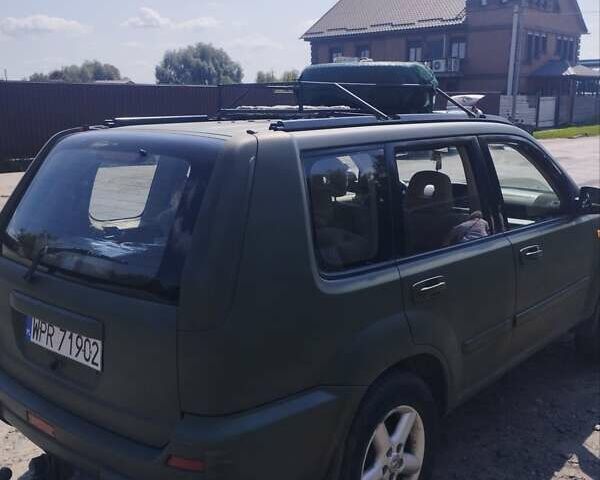 Зеленый Ниссан ИксТрейл, объемом двигателя 2 л и пробегом 230 тыс. км за 3000 $, фото 3 на Automoto.ua