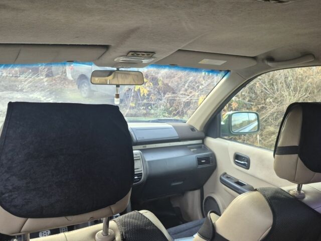 Зеленый Ниссан ИксТрейл, объемом двигателя 2 л и пробегом 334 тыс. км за 3974 $, фото 6 на Automoto.ua