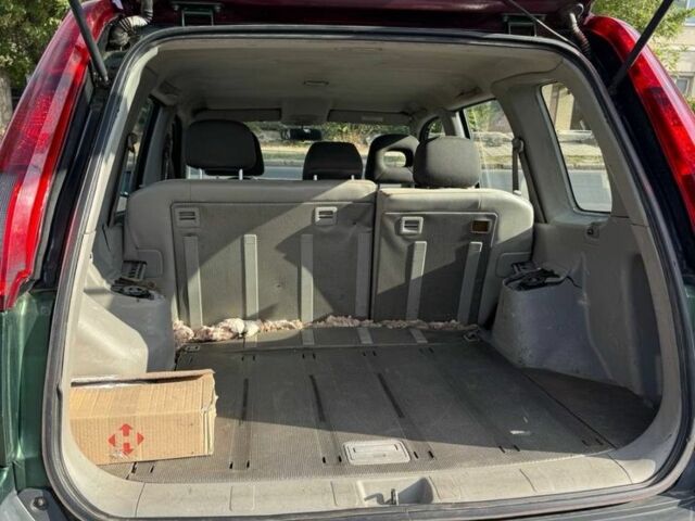 Зеленый Ниссан ИксТрейл, объемом двигателя 2.2 л и пробегом 300 тыс. км за 2999 $, фото 10 на Automoto.ua