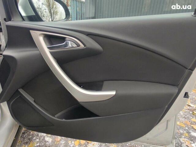 Серый Опель Астра Джей, объемом двигателя 17 л и пробегом 329 тыс. км за 8690 $, фото 14 на Automoto.ua