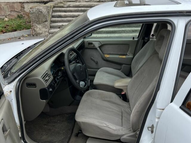 Белый Опель Астра, объемом двигателя 1.6 л и пробегом 300 тыс. км за 950 $, фото 1 на Automoto.ua