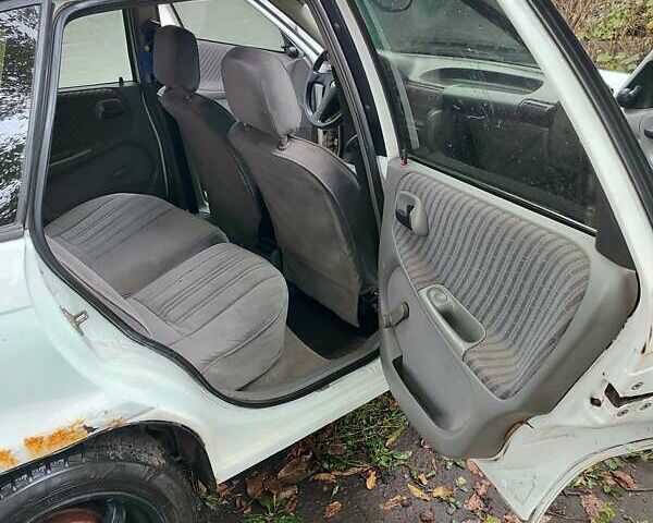 Белый Опель Астра, объемом двигателя 1.4 л и пробегом 312 тыс. км за 1100 $, фото 11 на Automoto.ua