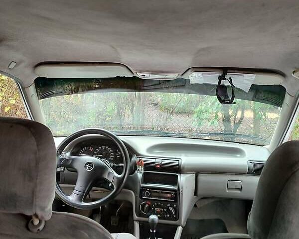 Белый Опель Астра, объемом двигателя 1.4 л и пробегом 312 тыс. км за 1100 $, фото 10 на Automoto.ua