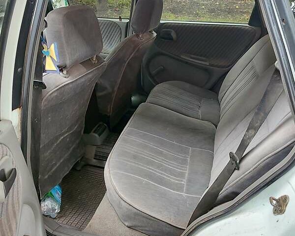 Белый Опель Астра, объемом двигателя 1.4 л и пробегом 312 тыс. км за 1100 $, фото 13 на Automoto.ua