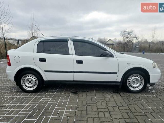 Белый Опель Астра, объемом двигателя 1.2 л и пробегом 263 тыс. км за 2999 $, фото 9 на Automoto.ua