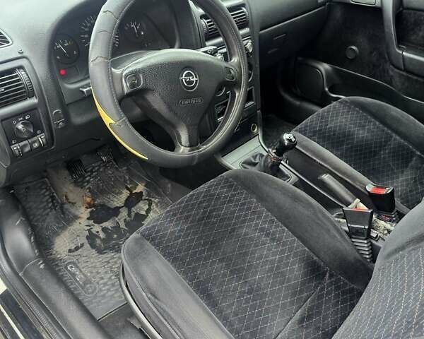 Белый Опель Астра, объемом двигателя 1.2 л и пробегом 263 тыс. км за 2999 $, фото 15 на Automoto.ua