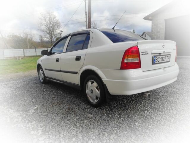 Белый Опель Астра, объемом двигателя 1.4 л и пробегом 216 тыс. км за 3650 $, фото 2 на Automoto.ua