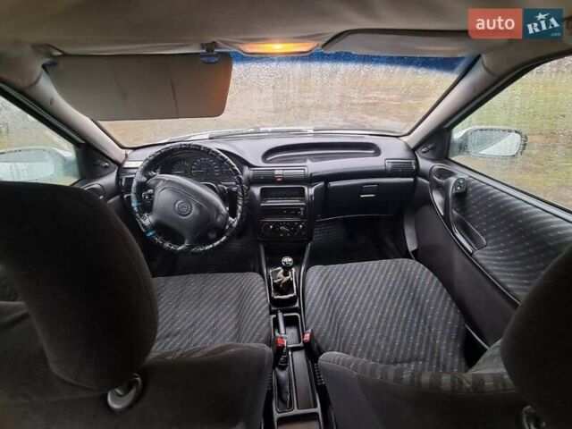 Білий Опель Астра, об'ємом двигуна 1.4 л та пробігом 240 тис. км за 1450 $, фото 8 на Automoto.ua