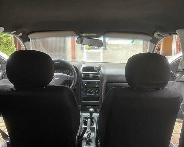 Белый Опель Астра, объемом двигателя 1.7 л и пробегом 314 тыс. км за 3800 $, фото 12 на Automoto.ua