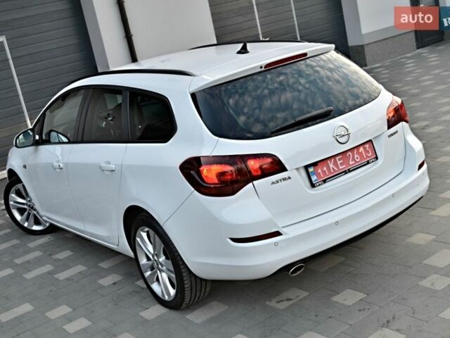 Білий Опель Астра, об'ємом двигуна 1.4 л та пробігом 228 тис. км за 6555 $, фото 25 на Automoto.ua