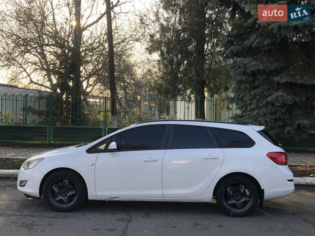 Белый Опель Астра, объемом двигателя 1.25 л и пробегом 321 тыс. км за 7499 $, фото 2 на Automoto.ua