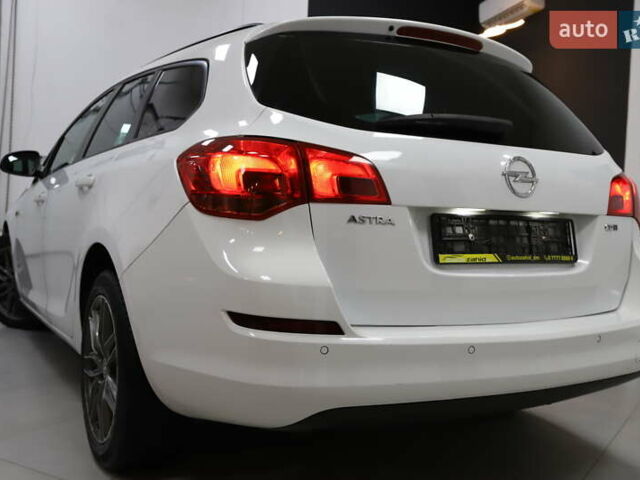 Білий Опель Астра, об'ємом двигуна 1.7 л та пробігом 144 тис. км за 8899 $, фото 44 на Automoto.ua