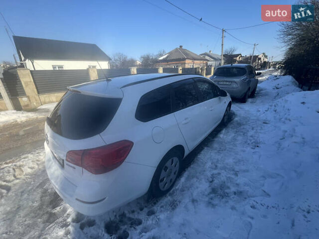 Белый Опель Астра, объемом двигателя 1.25 л и пробегом 255 тыс. км за 5800 $, фото 3 на Automoto.ua