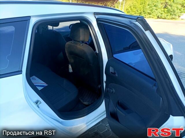 Белый Опель Астра, объемом двигателя 1.4 л и пробегом 76 тыс. км за 9600 $, фото 2 на Automoto.ua