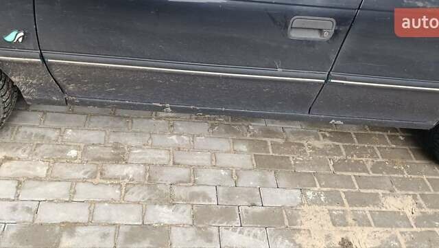 Черный Опель Астра, объемом двигателя 1.4 л и пробегом 256 тыс. км за 1450 $, фото 1 на Automoto.ua