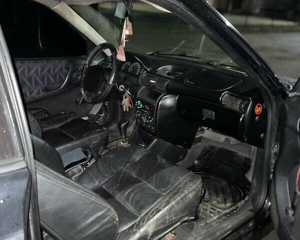 Черный Опель Астра, объемом двигателя 1.6 л и пробегом 300 тыс. км за 1200 $, фото 4 на Automoto.ua
