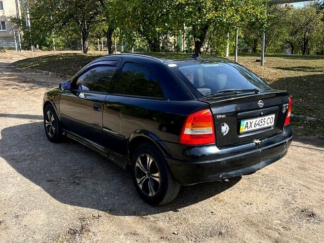 Черный Опель Астра, объемом двигателя 1.6 л и пробегом 264 тыс. км за 1300 $, фото 4 на Automoto.ua