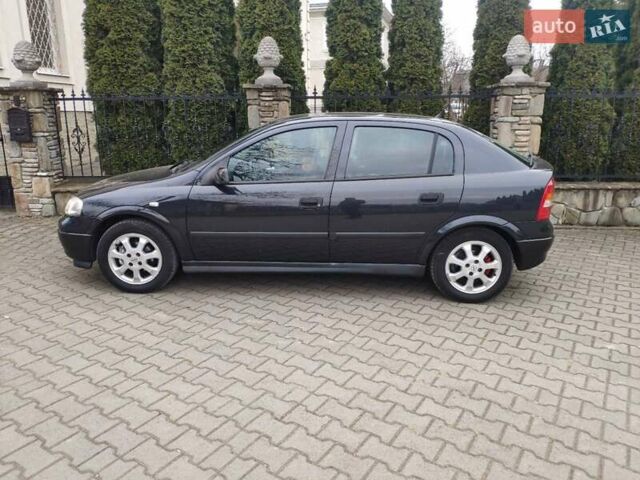 Черный Опель Астра, объемом двигателя 1.6 л и пробегом 246 тыс. км за 3700 $, фото 1 на Automoto.ua