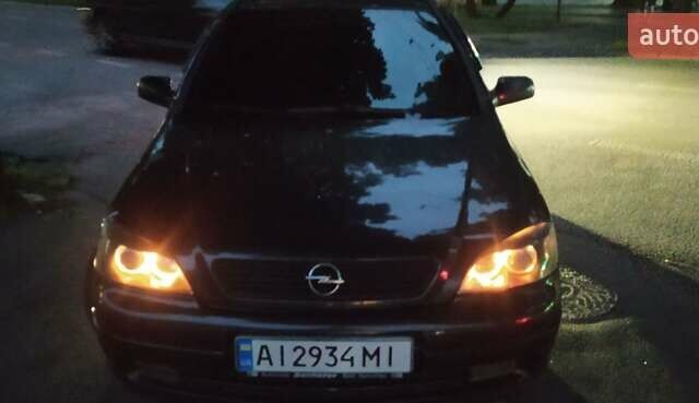 Черный Опель Астра, объемом двигателя 1.6 л и пробегом 385 тыс. км за 3900 $, фото 7 на Automoto.ua