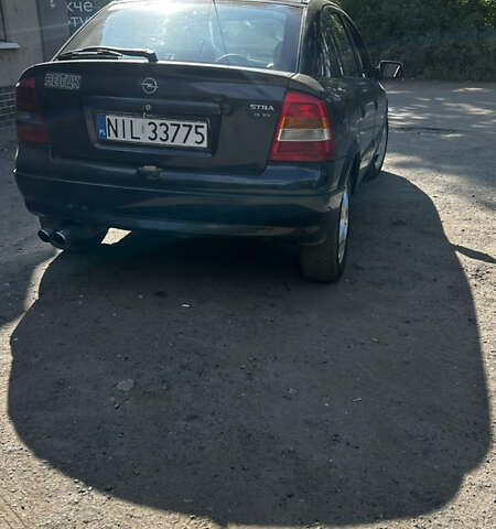 Черный Опель Астра, объемом двигателя 1.9 л и пробегом 300 тыс. км за 2053 $, фото 2 на Automoto.ua