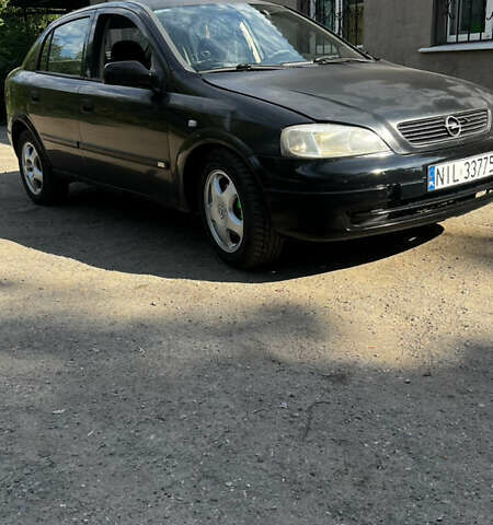 Черный Опель Астра, объемом двигателя 1.9 л и пробегом 300 тыс. км за 2053 $, фото 4 на Automoto.ua