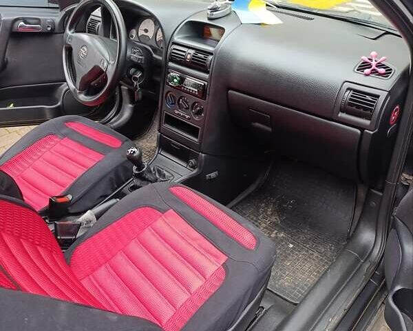 Черный Опель Астра, объемом двигателя 2 л и пробегом 311 тыс. км за 1650 $, фото 4 на Automoto.ua