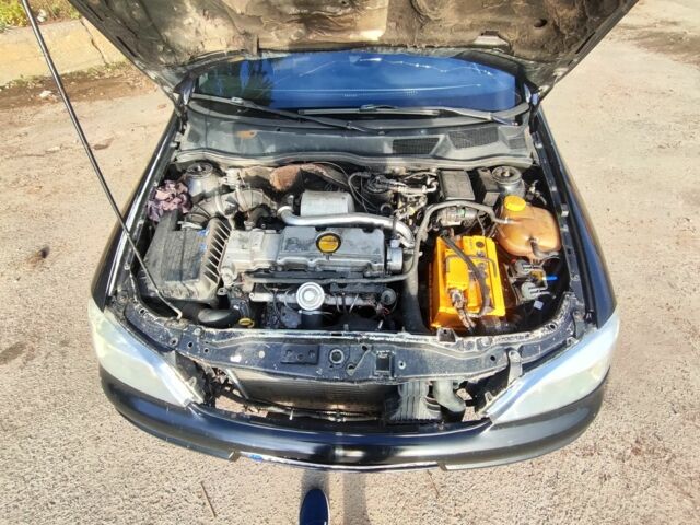 Черный Опель Астра, объемом двигателя 2 л и пробегом 299 тыс. км за 2141 $, фото 7 на Automoto.ua