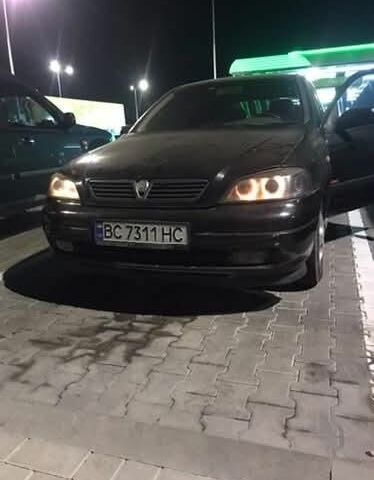 Черный Опель Астра, объемом двигателя 1.8 л и пробегом 230 тыс. км за 2400 $, фото 2 на Automoto.ua