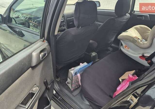 Черный Опель Астра, объемом двигателя 1.7 л и пробегом 296 тыс. км за 3600 $, фото 3 на Automoto.ua