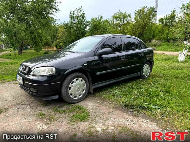 Черный Опель Астра, объемом двигателя 1.6 л и пробегом 250 тыс. км за 3600 $, фото 1 на Automoto.ua