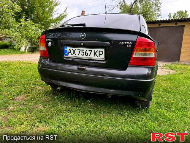 Черный Опель Астра, объемом двигателя 1.6 л и пробегом 250 тыс. км за 3600 $, фото 3 на Automoto.ua