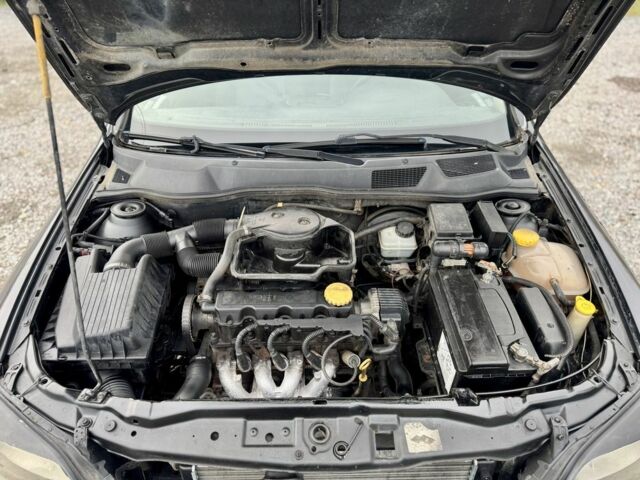 Черный Опель Астра, объемом двигателя 1.6 л и пробегом 258 тыс. км за 1350 $, фото 10 на Automoto.ua