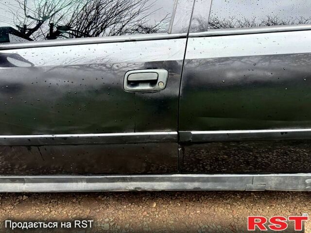 Черный Опель Астра, объемом двигателя 1.6 л и пробегом 250 тыс. км за 2800 $, фото 6 на Automoto.ua