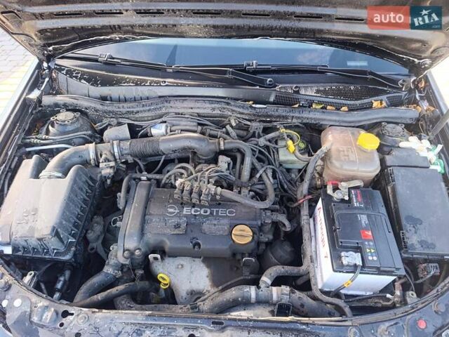 Черный Опель Астра, объемом двигателя 1.4 л и пробегом 250 тыс. км за 4000 $, фото 7 на Automoto.ua