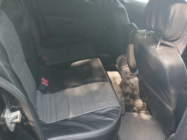 Черный Опель Астра, объемом двигателя 1.6 л и пробегом 265 тыс. км за 3999 $, фото 5 на Automoto.ua