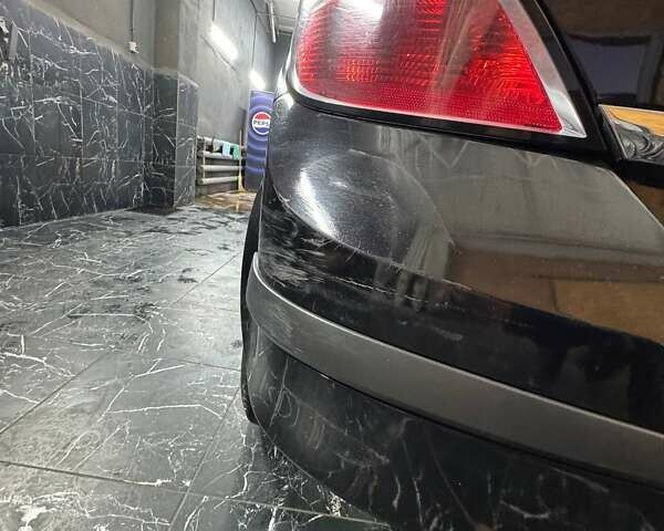 Черный Опель Астра, объемом двигателя 1.4 л и пробегом 219 тыс. км за 5000 $, фото 5 на Automoto.ua