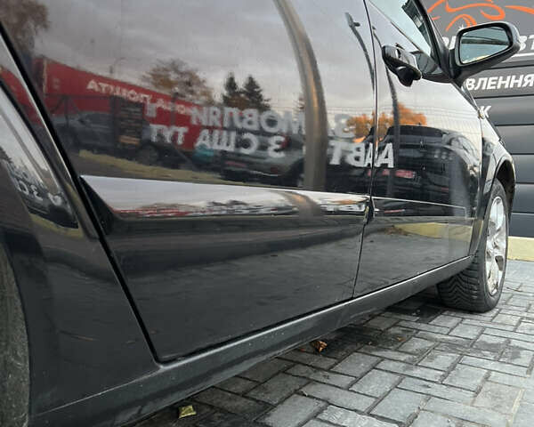 Черный Опель Астра, объемом двигателя 1.8 л и пробегом 165 тыс. км за 5500 $, фото 4 на Automoto.ua