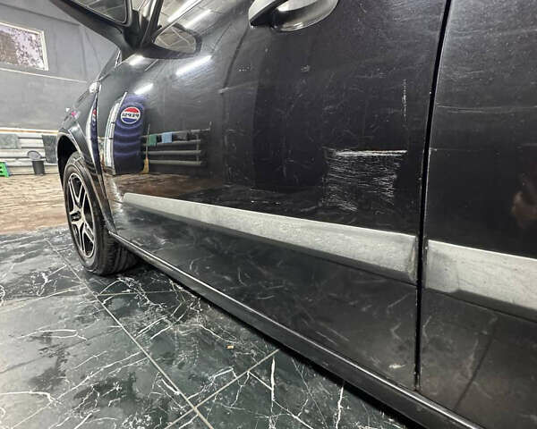 Черный Опель Астра, объемом двигателя 1.4 л и пробегом 220 тыс. км за 4700 $, фото 1 на Automoto.ua