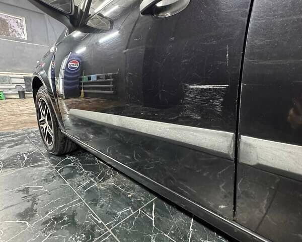 Черный Опель Астра, объемом двигателя 1.4 л и пробегом 219 тыс. км за 5000 $, фото 4 на Automoto.ua