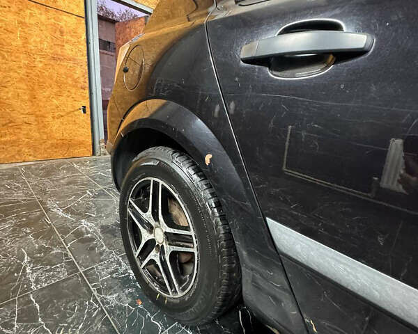 Черный Опель Астра, объемом двигателя 1.4 л и пробегом 220 тыс. км за 4700 $, фото 6 на Automoto.ua